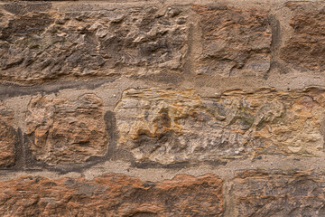 Part of a stone wall, for background or texture. Old castle stone wall texture background. The texture of a stone wall. Stone wall as a background or texture.