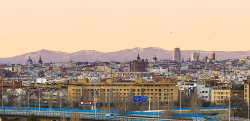 Panoramic view of the city of Madrid during a sunset, roofs and skyline