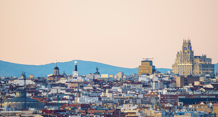 Panoramic view of the city of Madrid during a sunset, roofs and skyline - obrazy, fototapety, plakaty