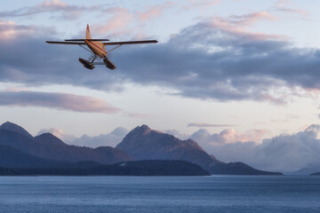 Seaplane Aircraft Flying over the Pacific Ocean Coast. Sunset or Sunrise dramatic Colorful Sky.. 3d Rendering Adventure Dream Concept Artwork. Background Nature Image from Alaska.