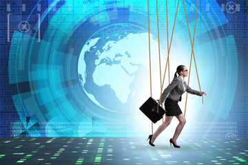 Businesswoman puppet being manipulated by ropes