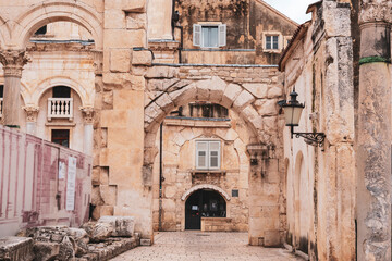 Fototapeta na wymiar Old square inside Diocletian's Palace in Split, Croatia
