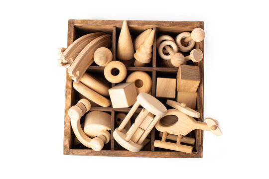 Children's wooden toys on a white background The concept of learning and education.