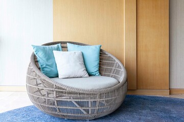 Empty brown plastic rattan sofa on the living room of the house