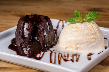 Petit gateau dessert - Traditional Sweet - Chocolate cake with ice cream - obrazy, fototapety, plakaty