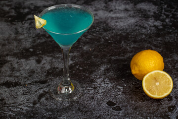 Blue Lagoon alcohol cocktail on concrete background