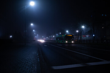 foggy city street with cars