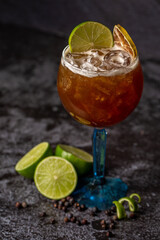 citrus gin cocktail with lemon on gray concrete background. with space for text