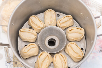 Manti with meat. National traditional food. Dough with meat. Russian food. Manti on a plate. Cook dinner.