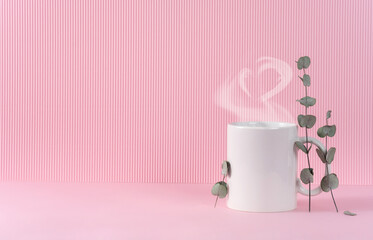 Fototapeta na wymiar Mockup white coffe cup or mug on a pink background with copy space. Blank template for your design, branding, business. Real photo. Eucalyptus branches. Hot drink steam in the form of heart