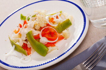 Fresh salad with boiled cauliflower, green beans and bell pepper
