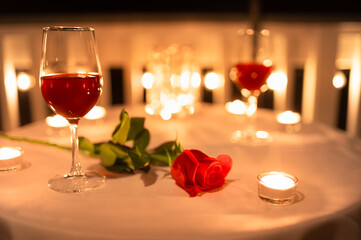 romantic dinner setting with rose and candle light