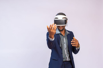 Close up portrait of handsome man playing video games in goggles or 3d glasses. african player wearing virtual reality headset for smart phone on his head, smiling, standing against white background