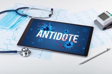 Tablet pc and doctor tools on white surface