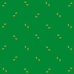 Colorful pattern of yellow kitchen sponges on green background. Top view. Flat lay. Pop art design