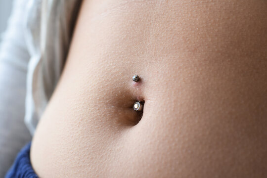 Closeup on belly button piercing