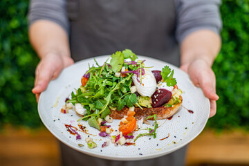person holding a salad