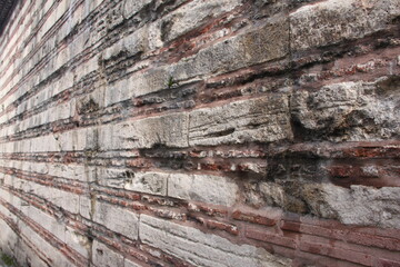 Obraz premium The texture of the stone wall. Old castle stone wall texture background. Stone wall as background or texture. Fragment of stone wall for background or texture