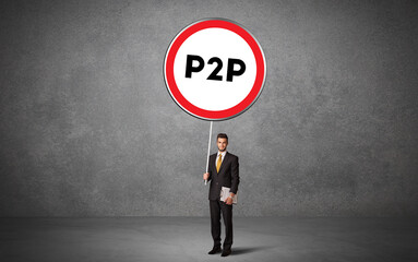 Obraz premium Young business person holdig traffic sign