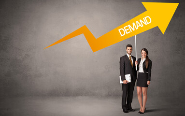 Fototapeta premium Young business person in casual holding road sign