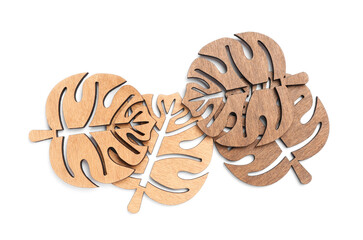 Leaf shaped wooden cup coasters on white background, top view