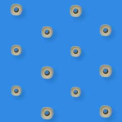 Colorful pattern of rolls of a white toilet paper isolated on blue background. Top view. Wallpaper for bathroom