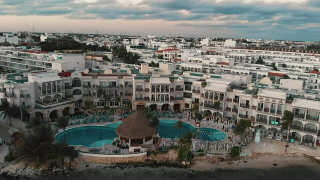 Aerial sunset over beach hotels. Playa del Carmen, Mexico. High quality 4k footage