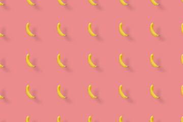 Colorful fruit pattern of yellow bananas on pink background. Top view. Flat lay. Pop art design