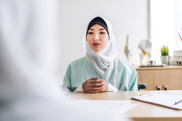Muslim asian woman doctor service help support discussing and consulting talk to muslim woman patient at meeting health medical care express trust concept in hospital.healthcare and medicine