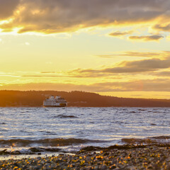 A yacht on the Puget sound during a beautiful sunrise in the morning in Washington