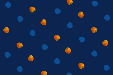 Colorful fruit pattern of fresh persimmons on blue background. Top view. Flat lay. Pop art design