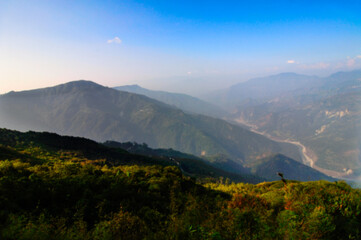 Naklejka na ściany i meble Blurred image of Valley at Silerygaon, Sikkim. Blurred background usage.