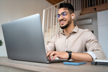 Man freelancer work online on laptop from home office using internet technology