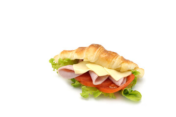 Ham cheese croissant with slice tomatoes and salad on white background.