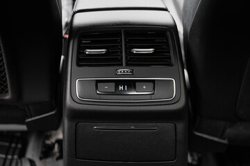 car rear seat air conditioning. interior of a business class car. Black leather interior