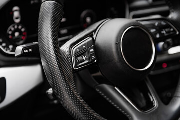 steering wheel close-up premium car. Leather interior of a business class car