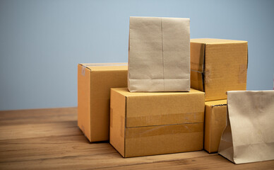 Packing products for delivery, shipping service. Delivery concept for private companies delivery with care, Craft present box. Online shopping. Packed household stuff for moving into new house.