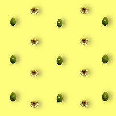 Colorful fruit pattern of fresh passion fruit on yellow background with shadows. Top view. Flat lay. Pop art design