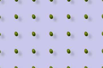 Colorful fruit pattern of fresh passion fruit on purple background with shadows. Top view. Flat lay. Pop art design