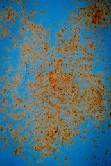 Flat image of orange and brown rust texture on a dirty blue background, texture and rust surface. background, wallpaper, abstract.