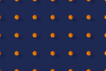 Colorful fruit pattern of fresh tangerines on blue background with shadows. Mandarine. Top view. Flat lay. Pop art design