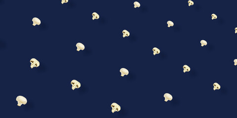 Colorful pattern of fresh mushrooms on blue background. Champignon sliced. Top view. Flat lay. Pop...