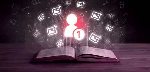 Open book with social networking icons above