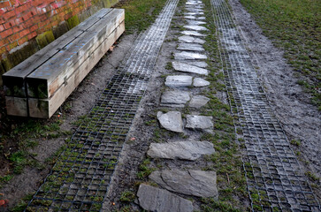 paved lawns with a share of gravel allow b in the city to park cars in the parking lot. sometimes they are reinforced with plastic grass tiles with locks that can withstand even heavier vehicle 