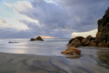 Fototapeta na wymiar Rocky seashore at sunset, 2022.1.30