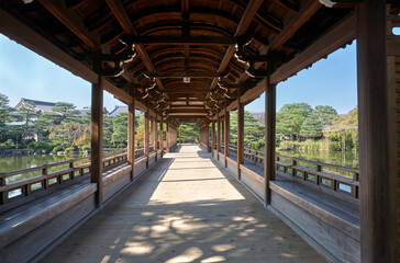 Gallery of Taihei-kaku (Hashidono) covered bridge in the garden of Heian-jingu Shrine. Kyoto. Japan