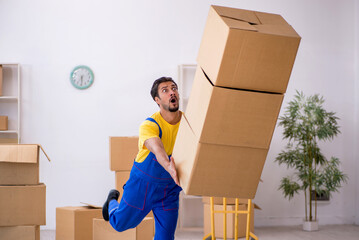 Young male contractor doing home relocation