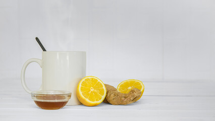 Fototapeta na wymiar Hot Tea With Lemon, Ginger and Honey Home Remedies For Illness 