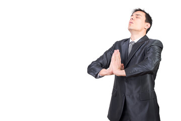 Obraz na płótnie Canvas Man in elegant suit meditating in studio
