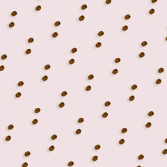 Colorful pattern of coffee beans on light pink background. Top view. Flat lay. Pop art